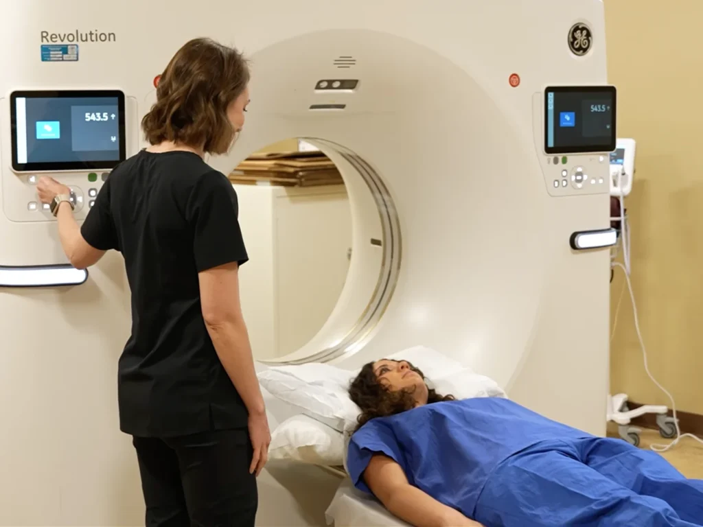 A technologist makes sure you are comfortable and properly aligned for imaging.