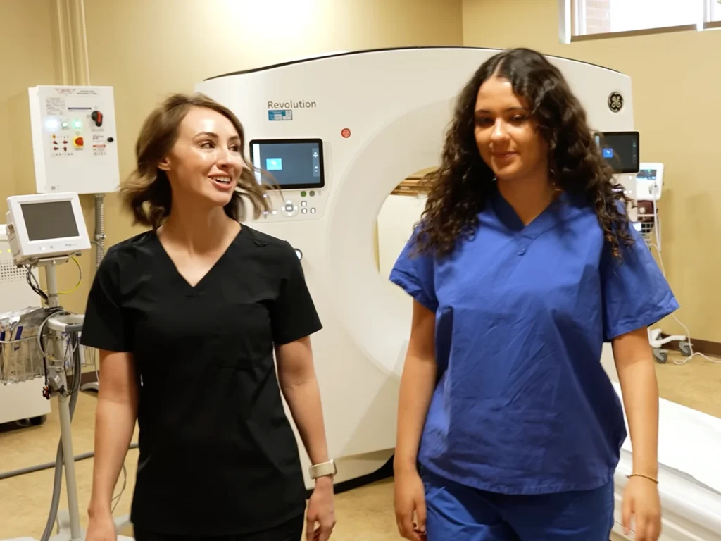 A patient is guided back to the changing area.