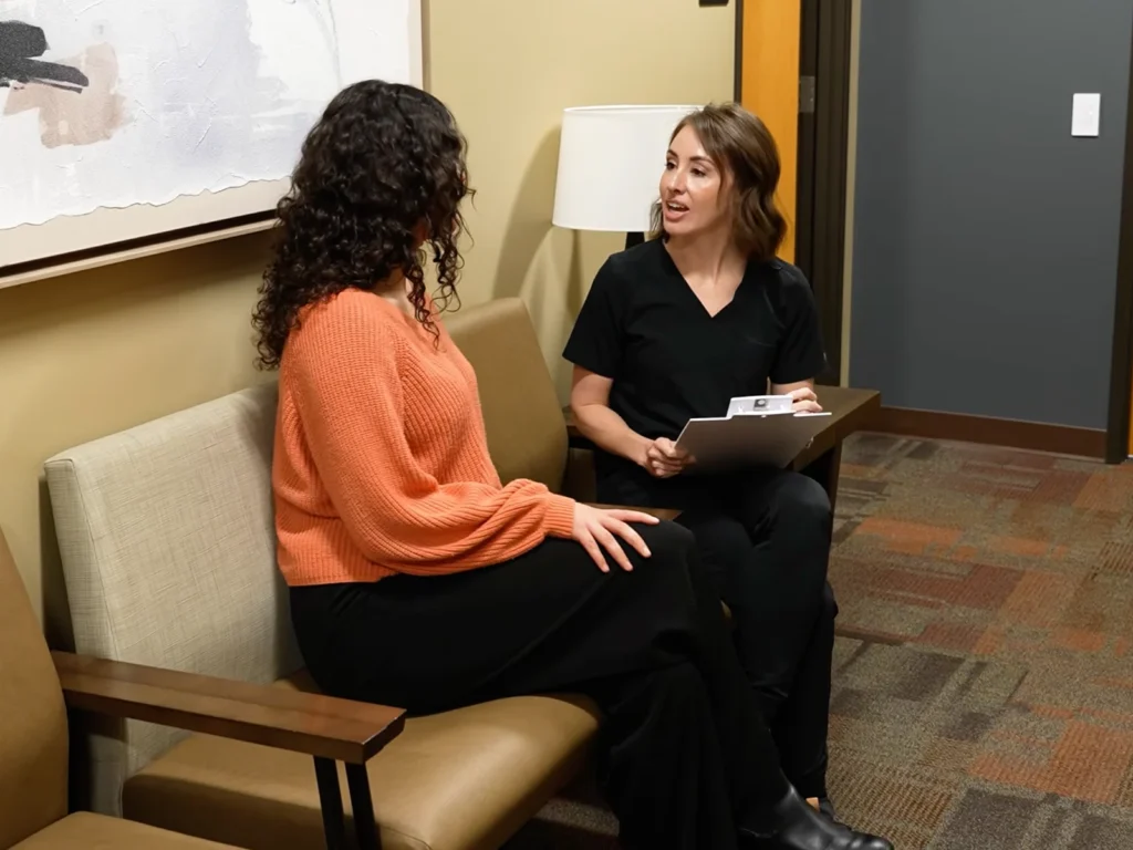A team member talks with the patient and answers any final questions