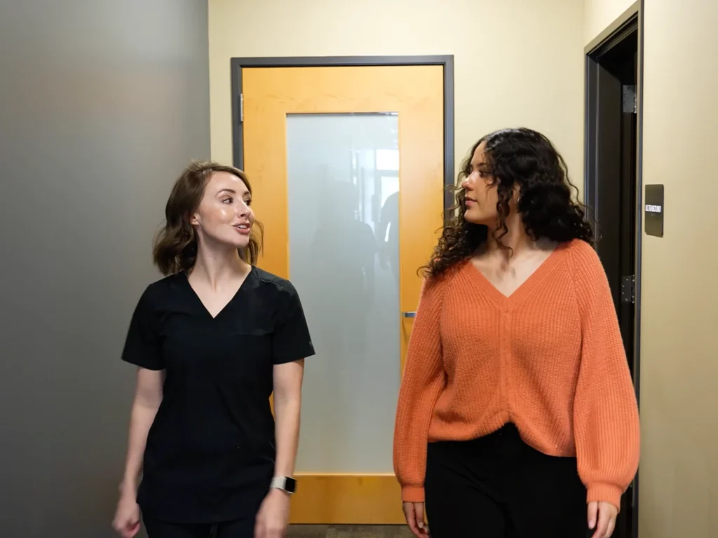 A patient is guided back to the lobby