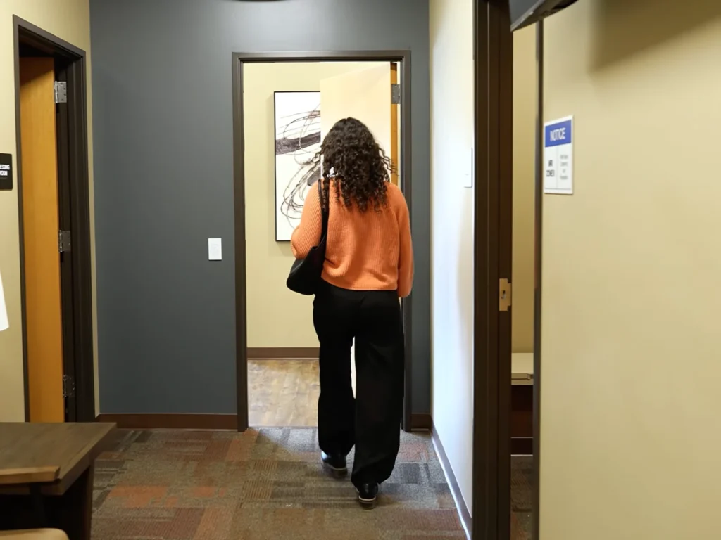 A patient is done with her exam and leaves the center